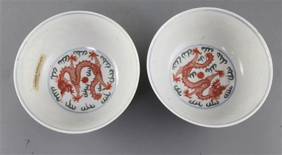 A pair of Chinese doucai dragon bowls, late 19th/early 20th century, diameter 15cm, one with small reglued chip to rim